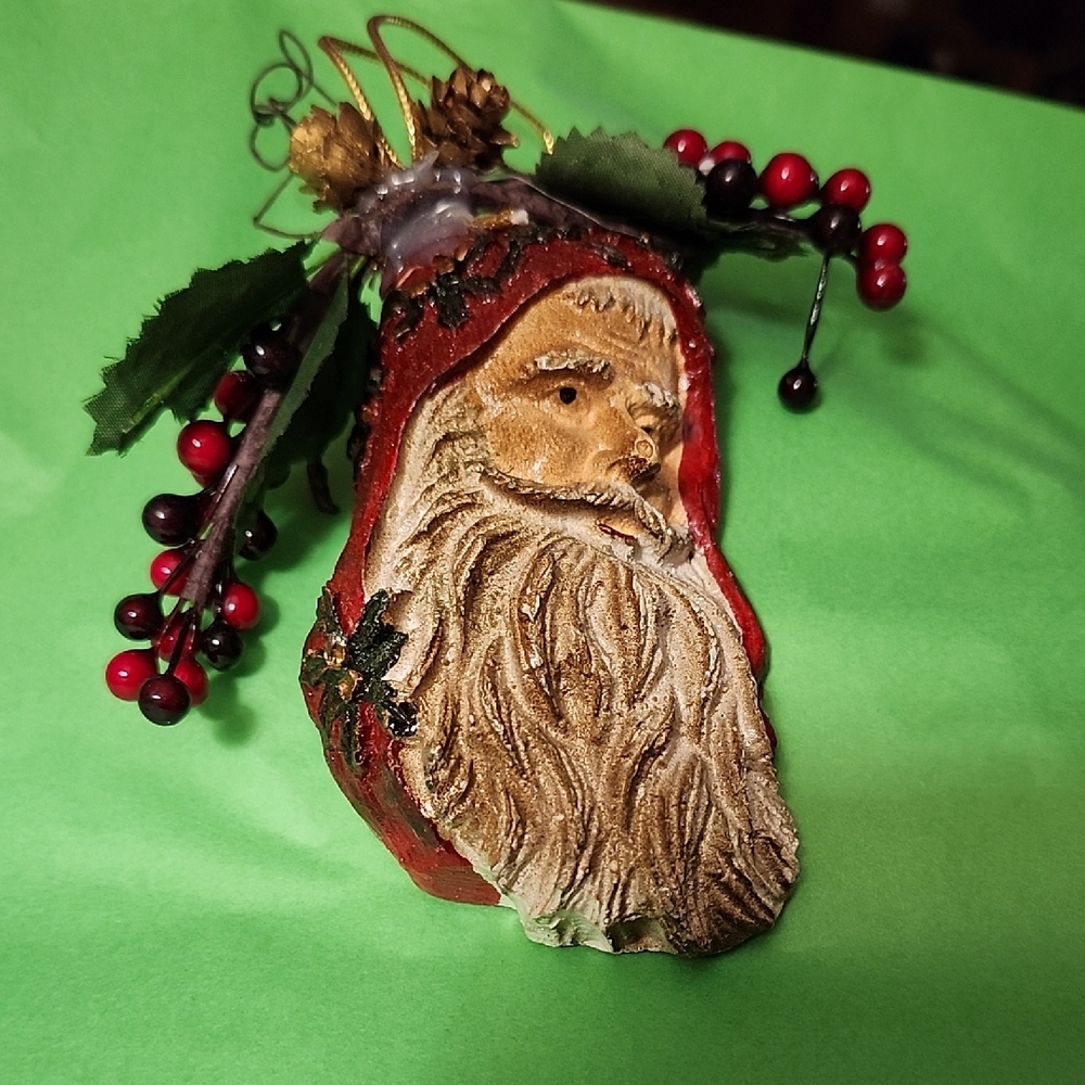 Festive Santa Ornament with Red and Gold Accents